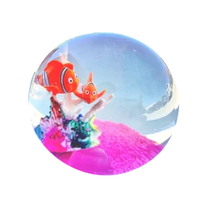 An image of the ocean squishy Kiedle stress ball with fish over a transparent background