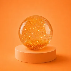 An image of the orange clear water Kiedle stress ball over an orange background