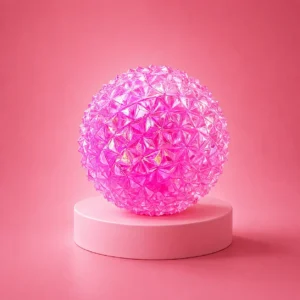 An image of the pink diamond squishy Kiedle stress ball over a pink background