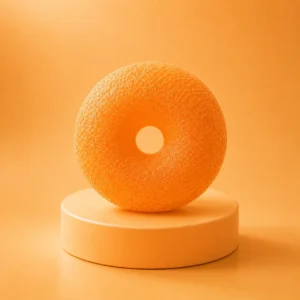 An image of the orange donut squishy Kiedle stress ball over an orange background