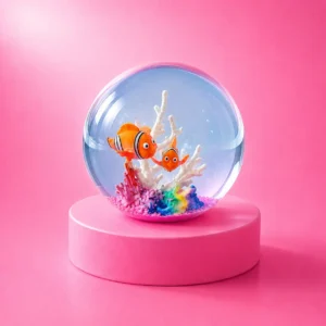 An image of the ocean squishy Kiedle stress ball with sharks over a pink background